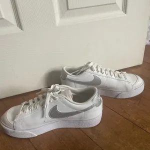 White and Silver Nike Sneakers
